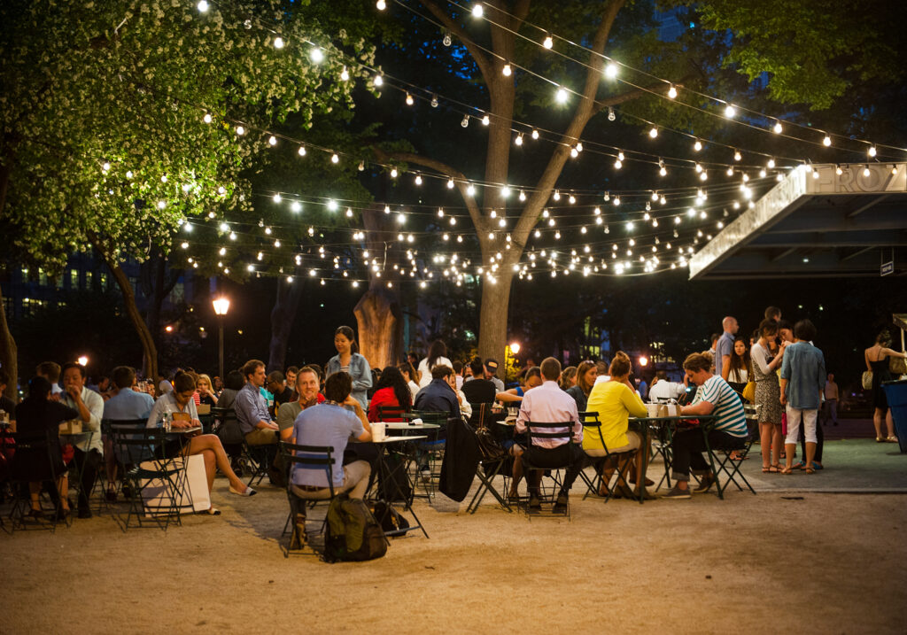BACKYARD OASIS WITH DINING AREA AND STRING LIGHTS